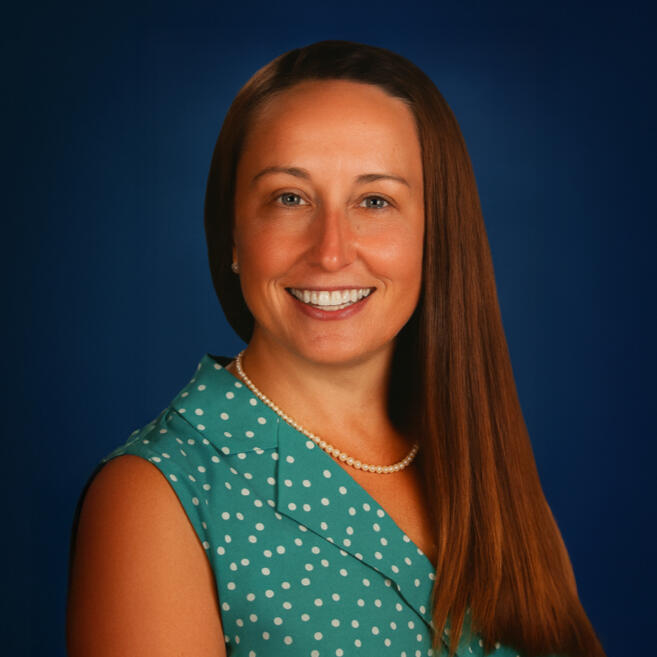 a person's hand on their laptop with a search engine tab overlayed across the picture